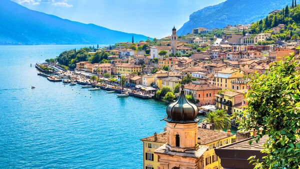 Beautiful village Limone Sul Garda on Garda Lake. The most famous tourist destination on lake. Aerial view. Lombardy, Italy.