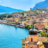 Beautiful village Limone Sul Garda on Garda Lake. The most famous tourist destination on lake. Aerial view. Lombardy, Italy.